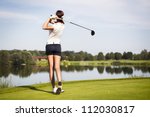 Girl golf player with driver...