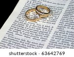 Small photo of Macro of 1 Corinthians 13:4 Love is Patient with Wedding Bands