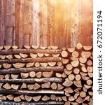 Stacked Firewood Heap Against...