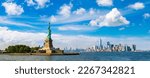 Small photo of Panorama of Statue of Liberty against Manhattan cityscape background in New York City, NY, USA