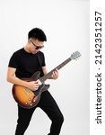 Young asian guy guitarist...