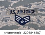 Small photo of August 31, 2020. US AIR FORCE branch tape and Senior Airman rank patch on digital tiger-stripe pattern Airman Battle Uniform (ABU)
