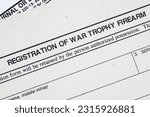 Registration of war trophy firearm form. US Army old paper background.