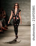 Small photo of NEW YORK-SEP 8: A model walks the runway at the Libertine fashion show during Mercedes-Benz Fashion Week Spring/Summer 2015 at The Pavillion at Lincoln Center on September 8, 2014 in New York City.