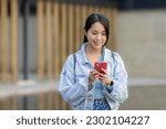 Woman look at mobile phone in city