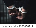 Arrested Man With Cuffed Hands...