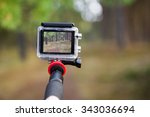 taking video with action camera on handheld stick
