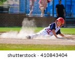 Youth Baseball Player Sliding...