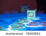 Small photo of STUTTGART, GERMANY - MAY 27: Performance by DJ Anton Funer at Mediaspace Festival in the Filmhaus uses a Reactable that lets you create music by arranging physical objects on May 27, 2011 in Stuttgart, Germany