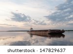 Cargo Ship Against Panorama Of...