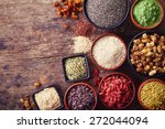 Bowls of various superfoods on wooden  background