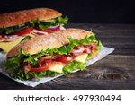 Two fresh submarine sandwiches...