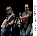 Small photo of GEORGE, WA - SEPT 9: Singer and guitar player Chrissie Hynde and guitar player Robbie MacIntosh of The Pretenders performs on stage at The Gorge Amphitheater September 9, 2000 in George, Wa.