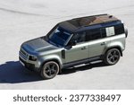 Small photo of Novyy Urengoy, Russia - August 18, 2023: Modern offroad car Land Rover Defender 110 (L663) in the city street.