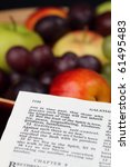 Small photo of Holy Bible open to Galatians 5. Focus on verse 22 - Fruit of the Spirit