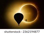 Small photo of Silhouettes of hot air balloons on backgound of solar eclipse in dark red sky. Solar eclipse is mysterious natural phenomenon when Moon passes between planet Earth and Sun. Mixed media image