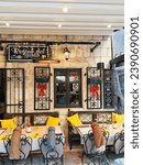 Small photo of Kotor, Montenegro - 25 december 2022: Tables with chairs stand in front of the old restaurant. Caption: Regina del gusto