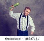 Small photo of young angry vegetarian minatory with zucchini cudgel
