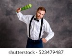 Small photo of young angry vegetarian minatory with zucchini cudgel