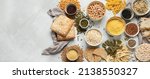 Small photo of Best sources of carbs on light gray background. Healthy food concept. Top view, flat lay, copy space, panorama