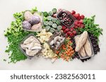 Frozen food, vegetables, fruits, meat, bread and fish on a white background. Top view