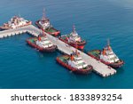 Fleet Of Tug Boats Moored In A...