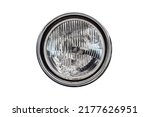 Old round headlight, an old-timer vehicle detail isolated on white background, close up