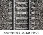 Railway background texture. Steel rails mounted on gray concrete sleepers. Industrial transportation photo pattern