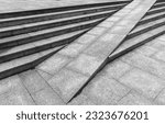 Small photo of Gray granite stairs with a ramp, abstract outdoor urban architecture background photo