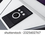 Small photo of Built-in tabletop input device, trackball mouse is a pointing device consisting of a ball held by a socket containing sensors to detect a rotation of the ball about two axes