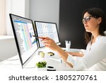 Analyst Working With Spreadsheet Business Data On Computer