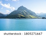 Lake In Mountains. Austrian Alps Travel Background