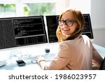programmer woman coding on... | Shutterstock . vector #1986023957