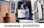 Small photo of House Mover Furniture Delivery Service. Unloading Truck