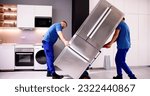 Small photo of Delivery And Install Of Refrigerator Appliance. Mover Carrying Fridge