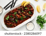 Small photo of Maghmour or Lebanese moussaka. Dish made from baked or fried eggplant with spices, chickpeas and tomato sauce. Eggplants are stewed in tomato sauce