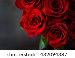 Bouquet of red roses on a black background. Top view