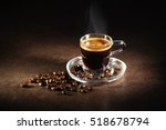 Cup of espresso coffee on dark background.