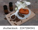 Body care products with caffeine, shampoo, soap and towel with coffee beans.