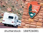 American National Parks RV Journey. National Park Service Shield. Zion National Park Entrance.