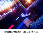 Las Vegas Slot Gambling Addiction. Men Playing Traditional Slot Machine.