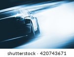 Speeding Car Background Photo Concept. Vehicle on a Road. Motorsport Backdrop Concept with Copy Space.
