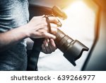 Professional Photography Job Concept. Photographer with Modern Digital Camera in Hand

