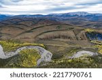 Small photo of Engineer Creek and Dempster Highway in breathtaking autumn fall wilderness landscape seen from above on Sapper Hill, Yukon Territory, YT, Canada