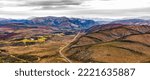 Small photo of Engineer Creek valley and Dempster Highway in breathtaking autumn fall wilderness landscape seen from above on Sapper Hill, Yukon Territory, YT, Canada