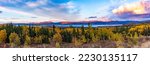 Sunset clouds over Lake Laberge boreal forest taiga autumn fall landscape wilderness panorama of Yukon Territory, Canada