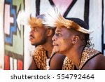 LESEDI CULTURAL VILLAGE, SOUTH AFRICA - NOVEMBER 4, 2016. Two young male Zulu tribe members wearing traditional warrior leopard skin garments and headdresses