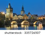 Evening view of the Charles Bridge in Prague, Czech Republic, with Old Town Bridge Tower and Old Town Water Tower