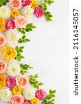Small photo of Composition of beautiful rose flowers on light background. Flowers frame.Top view, copy space.