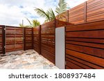 Backyard With Wooden Wall Of...